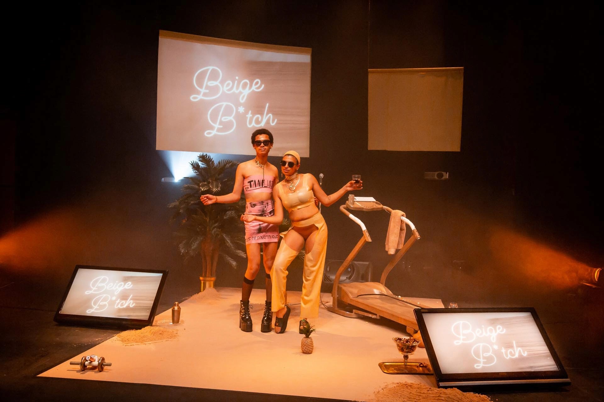 TAAHLIAH and Nima Séne pose together on the beige stage set at Take Me Somewhere