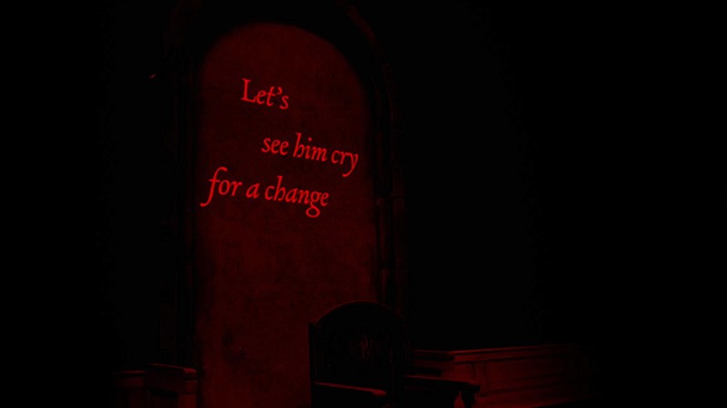 Red projected captions on the stone archway read 'Let's see him cry for a change'; simulation still.