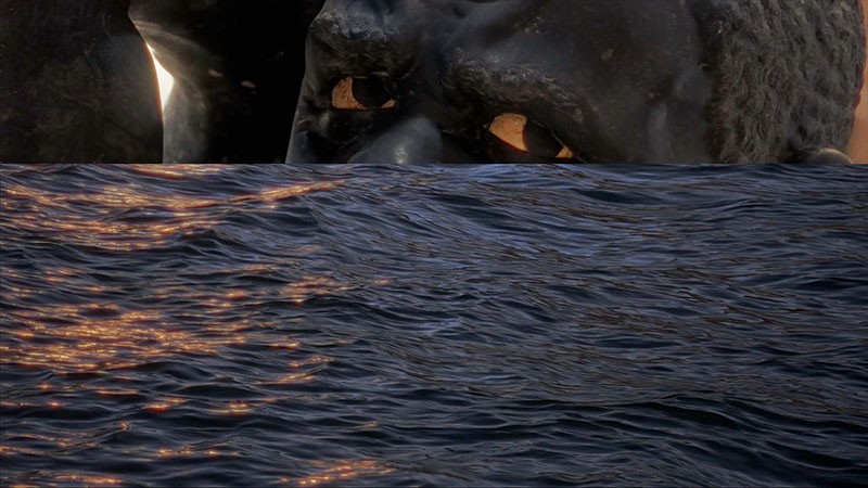 Venetian statue above dark rippling water catching golden light; film still from Lagareh