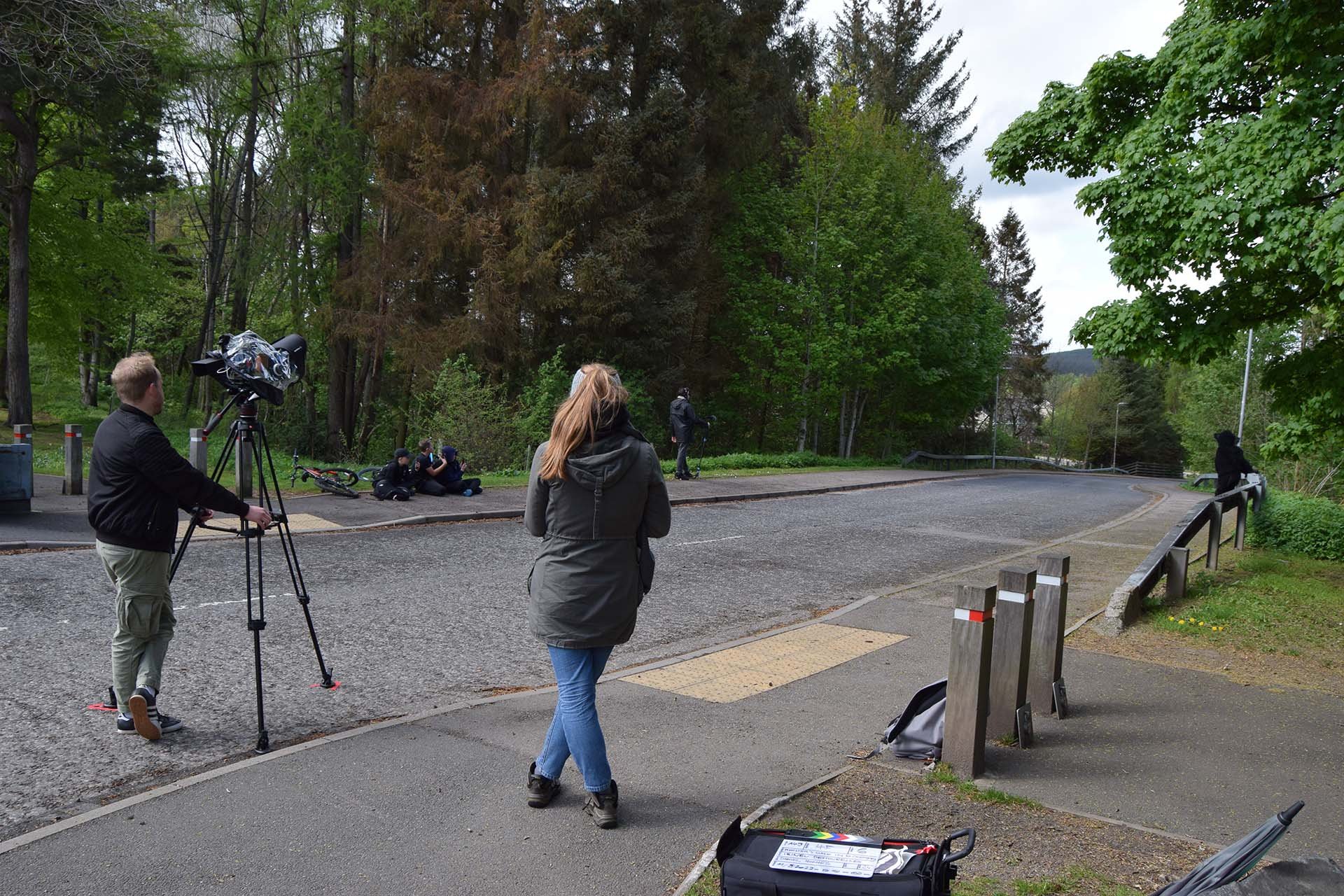 Behind the scenes: Daniel Hughes, Anita Krasowska, Mark Readhead and Irineu Destourelles filming in Huntly as onlookers watch